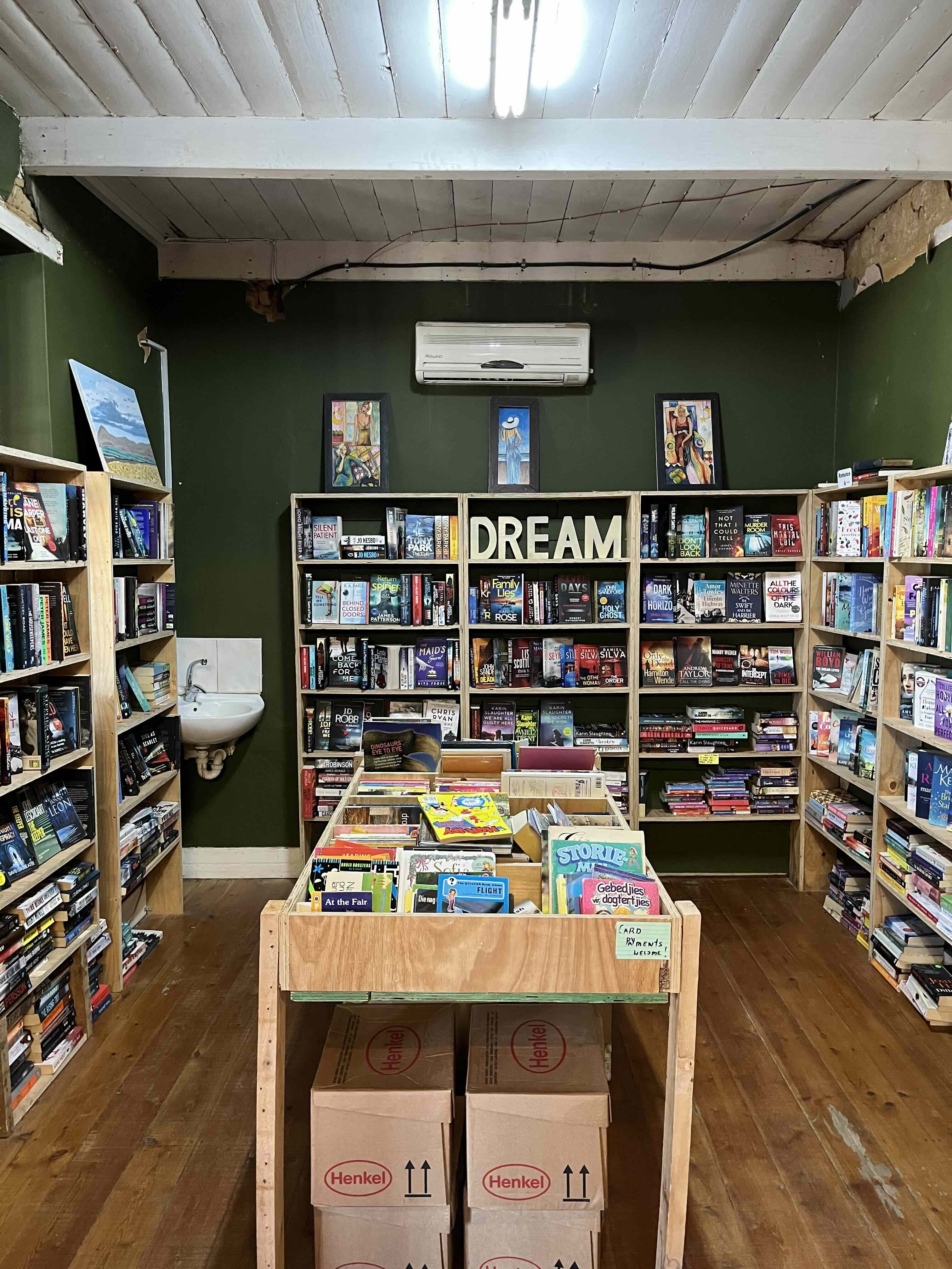 Shelves filled with second-hand books inside Mona Lisa 2nd Hand Books